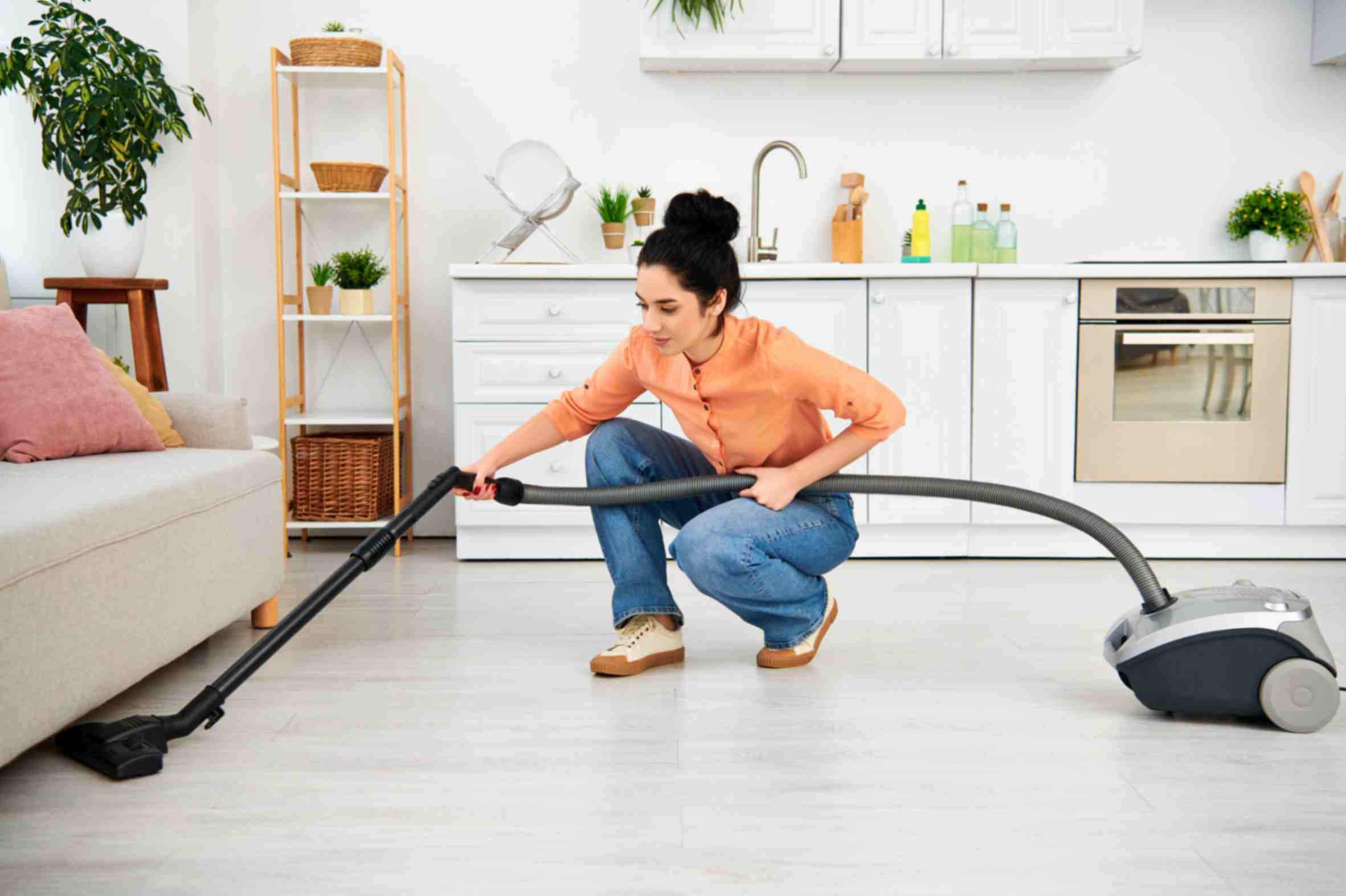 woman-elegantly-cleans-floor-with-vacuum