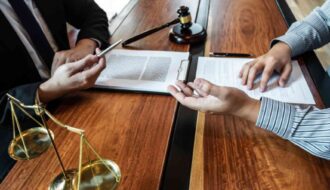 high-angle-view-lawyer-client-discussing-table